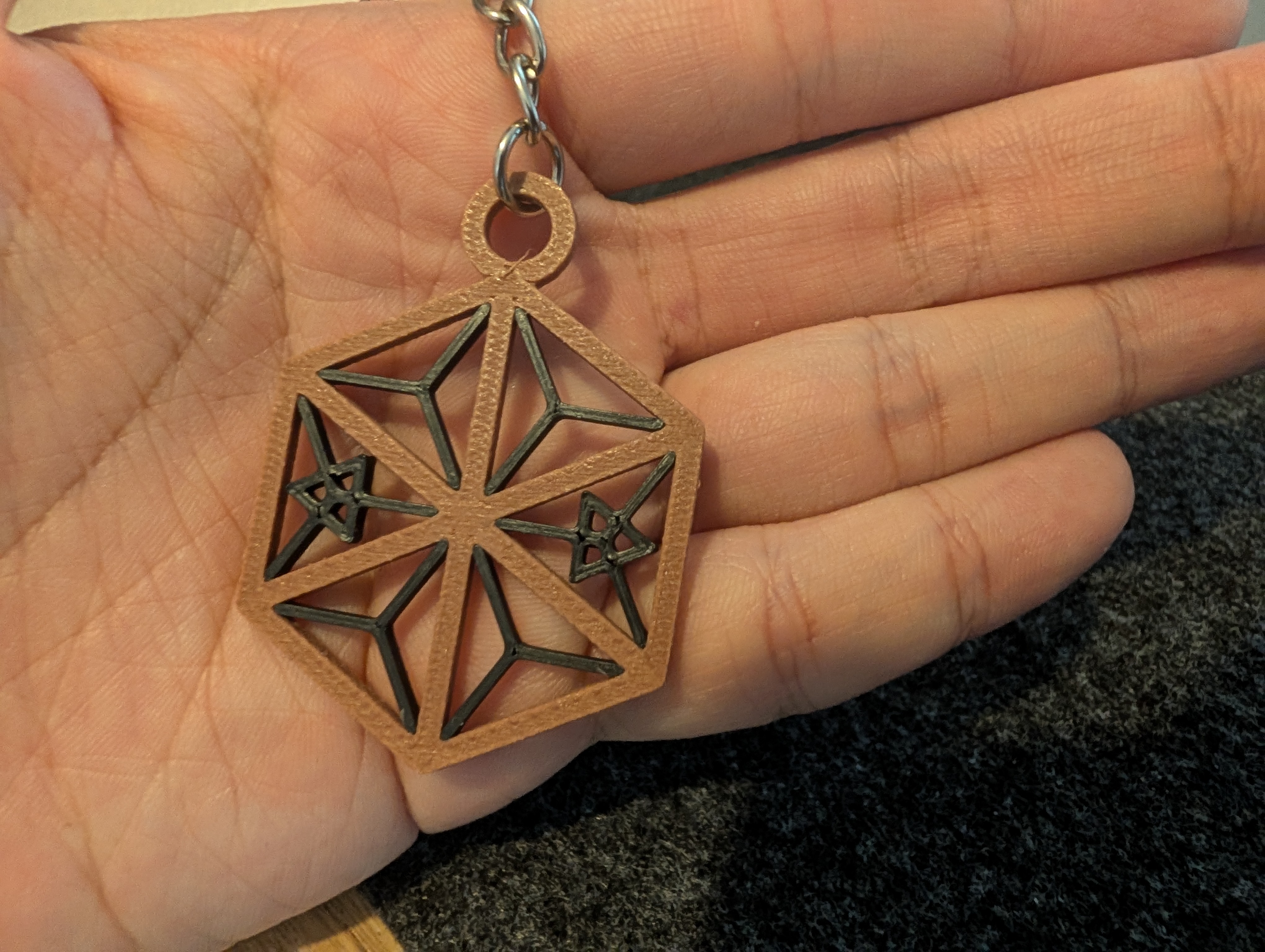 Detailed close-up of a 3D printed Kumiko keychain showing the crisp geometric lattice and keyring mounting loop