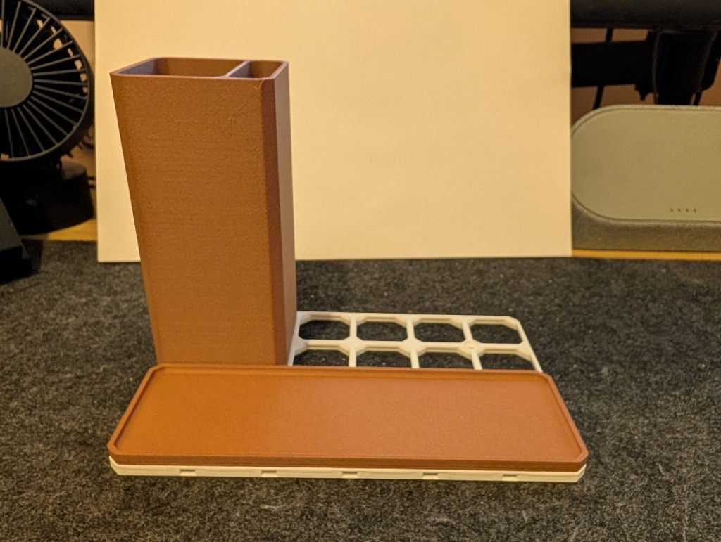 OpenGrid base plate with front tray and tall pen bin installed